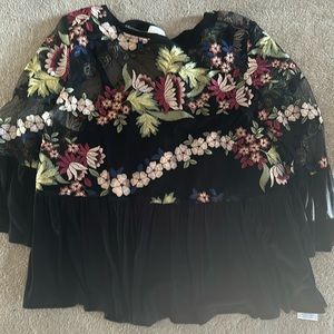 Black top with beautiful floral print from Anthropologie.
